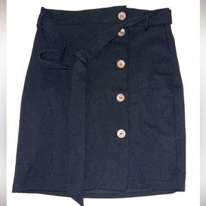 Black skirt with brown buttons. Never wore but no tags.